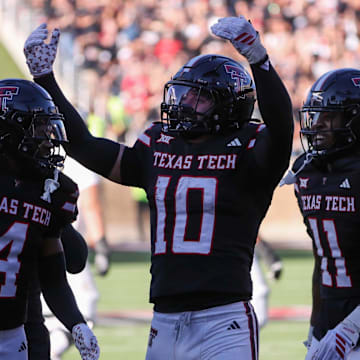 Texas Tech's Jacob Rodriguez (10) gestures to the crowd after making an interception against UCF during a Big 12 Conference football game.
