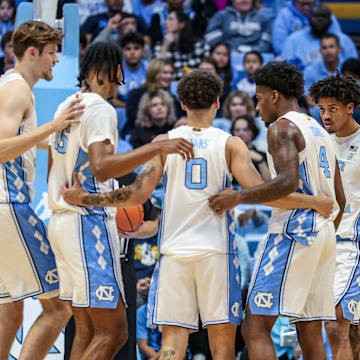 North Carolina players huddling up during a stoppage in play; Oct. 29, 2025