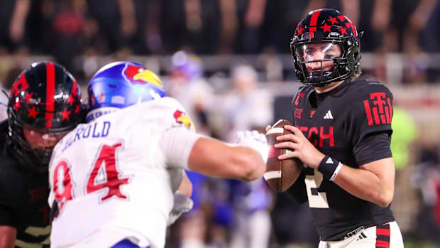Texas Tech's Behren Morton looks to pass against Kansas during a Big 12 Conference football game 