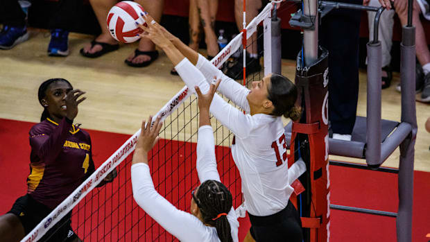 Nebraska Volleyball Merritt Beason gets her hands on the ball for a block. 