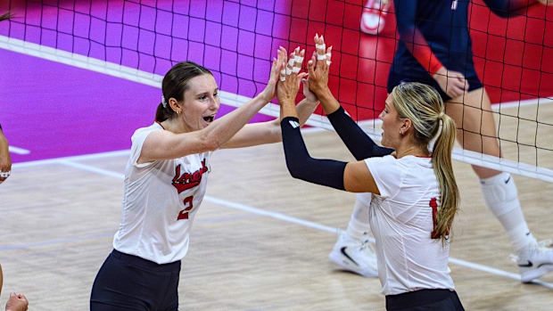 Bergen Reilly (2) High Fives Andi Jackson (15). 