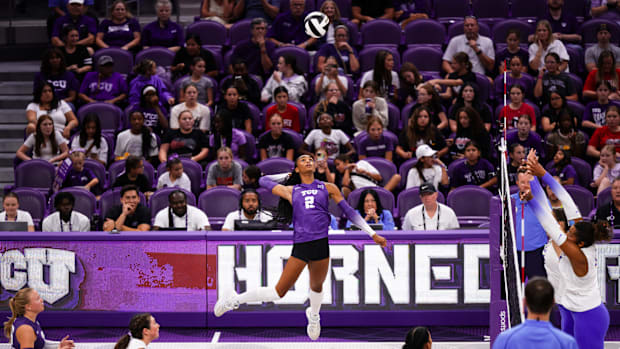 TCU Volleyball's Evan Hendrix (2) slams a kill against Missouri.