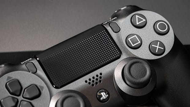 A zoomed-in photo of a black DualShock 4 controller for the PlayStation 4