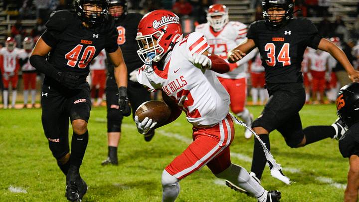 Oak Hills’ wide receiver Royalton Allen runs the ball during the X half of the game against Apple Valley on Friday, October 18, 2024 at Newton T. Bass Stadium in Apple Valley. Oak Hills defeated Apple Valley 30-14 inching closer to capturing the Mojave River League title for a fourth consecutive season.