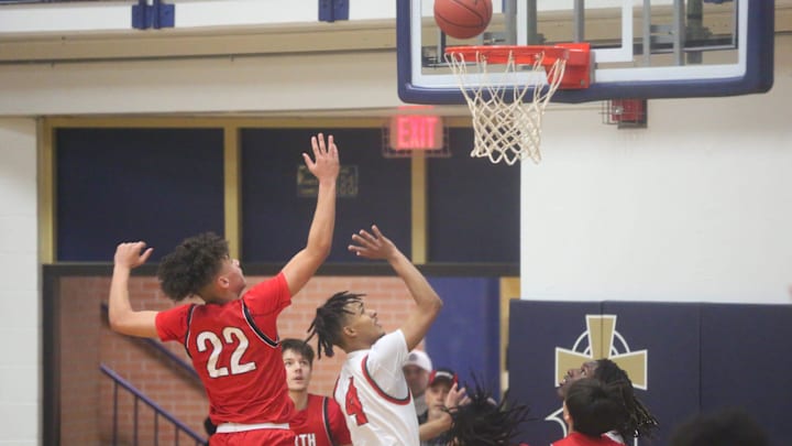 Highland Park's Mister Cameron shoots a floater against Shawnee Mission North in the Topeka Invitational Tournament semifinal on Friday, Jan. 19. Highland Park defeated Shawnee Mission North 67-52.