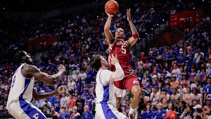 Feb 28, 2026; Gainesville, Florida, USA; Arkansas Razorbacks guard Darius Acuff Jr. (5) shoots against Florida Gators guard Urban Klavzar (7) during the first half at Exactech Arena at the Stephen C. O'Connell Center. Mandatory Credit: Travis Register-Imagn Images