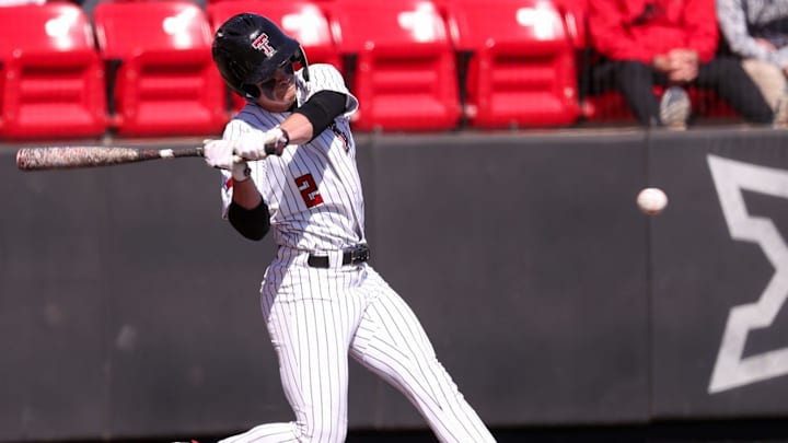 Texas Tech's Kyeler Thompson swings at a pitch against UAlbany during a non-conference baseball game, Sunday, Feb. 22, 2026, at Rip Griffin Park.