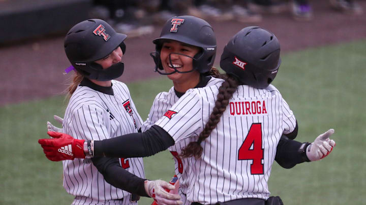 Texas Tech's Desirae Spearman hugs teammates at home plate after hitting a home run against Iowa State during a Big 12 Conference softball game, Friday, March 27, 2026, at Tracy Sellers Field.