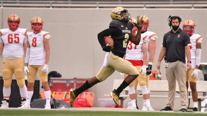 The Wofford Terriers take on VMI during football action at Gibbs Stadium in Spartanburg Saturday afternoon, March 27, 2021. Wofford wide receiver T.J. Luther (2) runs the ball across the field for a touchdown in the first minute of the game.

Shj Wofford Football 8