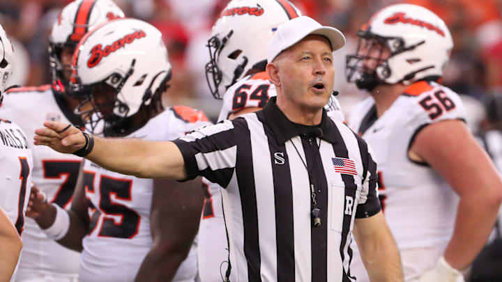 A Big 12 referee calls a penalty against Oregon State during a non-conference football game, Saturday, Sept. 13, 2025, at Jones AT&T Stadium.