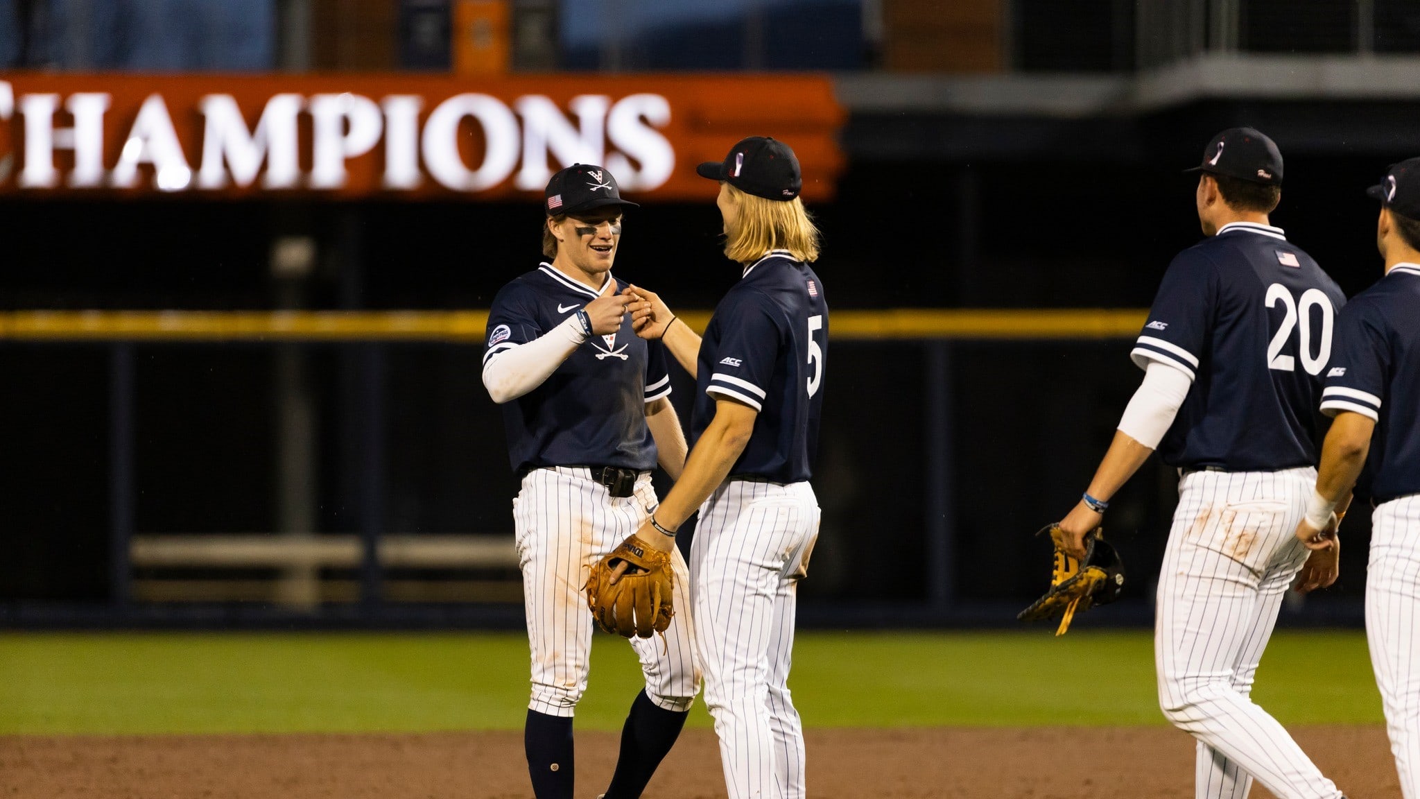 Griff O'Ferrall and Luke Hanson celebrate after Virginia baseball defeated Richmond at Disharoon Park.