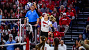 Nebraska middle blocker Andi Jackson gets a kill on the slide. She finished with an .833 hitting percentage to set a new school postseason record.