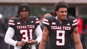 David Bailey (31) and Romello Height walk to the field before the Texas Tech football team's spring game, Saturday, April 19, 2025, at Jones AT&T Stadium.