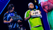 Kakeru and MenaRD proudly show off their fight-stick trophies at EVO Championship Series in Las Vegas, Nevada, USA on August 3, 2025.