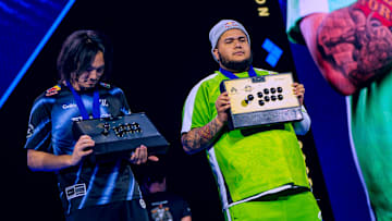 Kakeru and MenaRD proudly show off their fight-stick trophies at EVO Championship Series in Las Vegas, Nevada, USA on August 3, 2025.