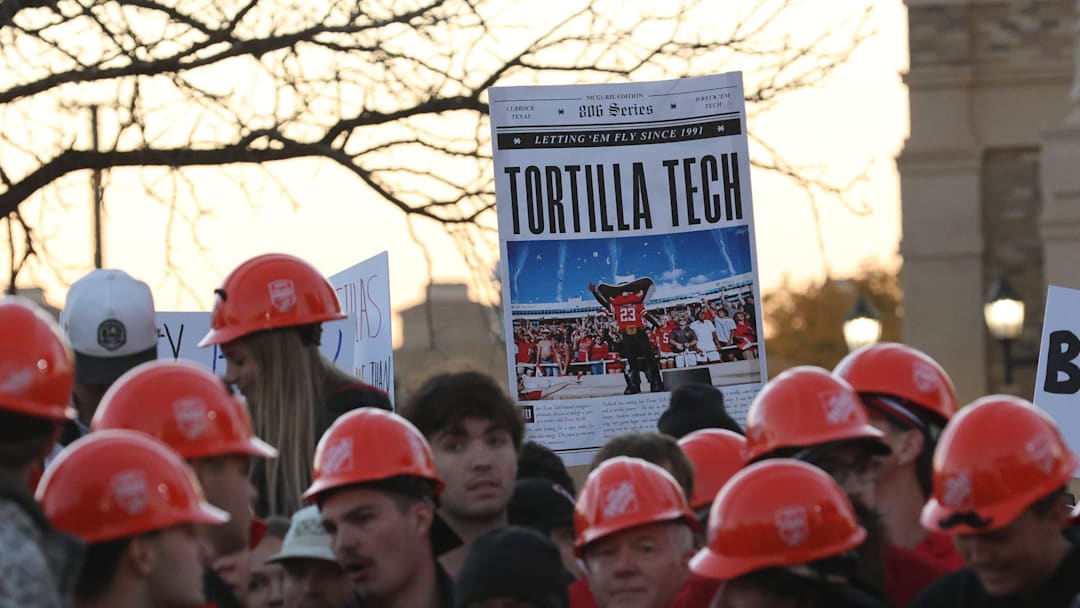 Texas Tech Red Raider fans hold signs while waiting for the start of ESPN's College GameDay