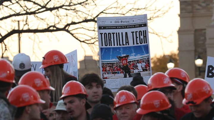 Texas Tech Red Raider fans hold signs while waiting for the start of ESPN's College GameDay
