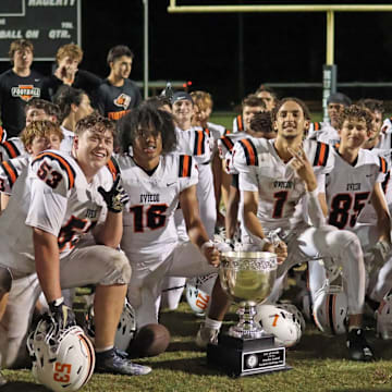 Oviedo High's football team celebrates after beating crosstown rival Hagerty, 42-28, last year to win Oviedo's annual Football Challenge Cup. The Lions play a competitive schedule again in 2025.