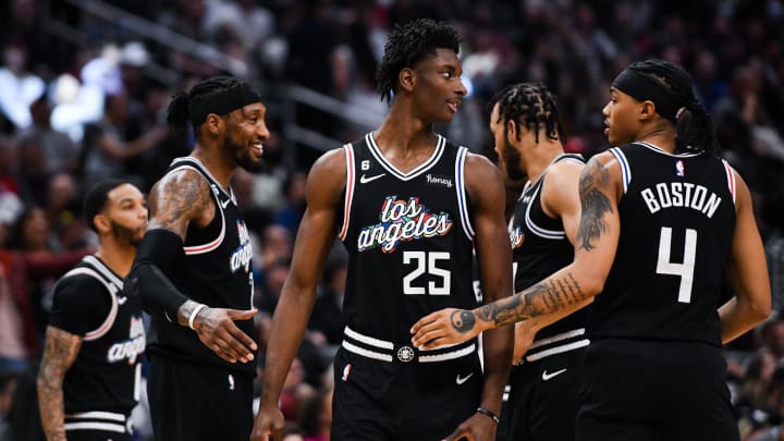 Apr 8, 2023; Los Angeles, California, USA; LA Clippers forward Moussa Diabate (25) celebrates with forward Robert Covington (23), guard Brandon Boston Jr. (4) and other teammates against the Portland Trail Blazers during the fourth quarter at Crypto.com Arena. Mandatory Credit: Jonathan Hui-USA TODAY Sports