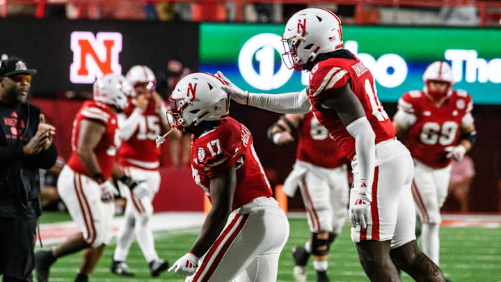 Willis McGahee IV (17) and Princewill Umanmielen celebrate Nebraska’s recovery of a Colorado fumble to secure the win. 