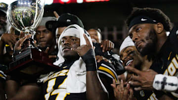 Sept 20, 2025; Columbia, Missouri, USA; Missouri Tigers Linebacker Triston Newson (14), Safety Marvin Burks Jr., and Linebacker Jeremiah Beasley pose with the Mayor's Cup trophy after securing the win.