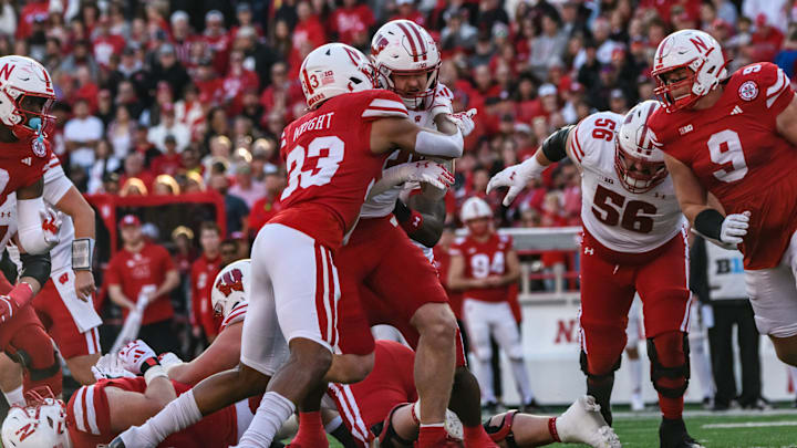 Javin Wright (33) makes a tackle on a Wisconsin runner. Javin Wright (33) makes a tackle on a Wisconsin runner.