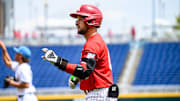 Cayden Brumbaugh points to the dugout after his first inning single. 