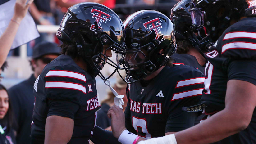 Texas Tech's Behren Morton and Reggie Virgil celebrate their touchdown connection against UCF during a Big 12 Conference football game, Saturday, Nov. 15, 2025, at Jones AT&T Stadium.