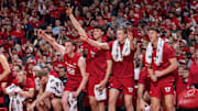 Wisconsin's bench celebrates during the Badgers' 96-76 victory over the Marquette Golden Eagles at the Kohl Center.