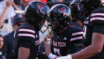 Texas Tech's Behren Morton and Reggie Virgil celebrate their touchdown connection against UCF during a Big 12 Conference football game, Saturday, Nov. 15, 2025, at Jones AT&T Stadium.
