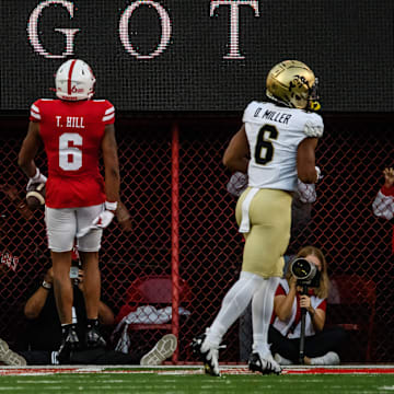 Tommi Hill (6) celebrates in the endzone after a pick six. 