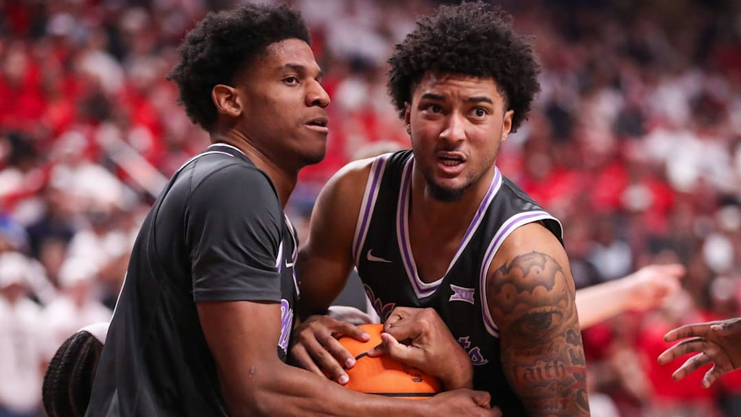 Kansas State players Taj Manning (left) and PJ Haggerty fight for a rebound against Texas Tech during a Big 12 Conference men's basketball game, Saturday, Feb. 21, 2026, in United Supermarkets Arena.