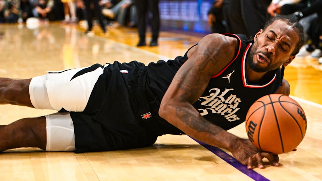Nov 1, 2023; Los Angeles, California, USA;  LA Clippers forward Kawhi Leonard (2) falls after being fouled by Los Angeles Lakers forward LeBron James (23) (not pictured) during the fourth quarter at Crypto.com Arena. Mandatory Credit: Jonathan Hui-Imagn Images