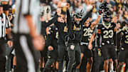 Nov 15, 2025; Winston-Salem, North Carolina, USA; The Wake Forest Demon Deacons sideline celebrates after a play against the North Carolina Tar Heels at Allegacy Federal Credit Union Stadium. Mandatory Credit: Wake Forest Athletics via Imagn Images