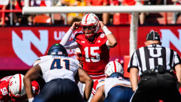 Dylan Raiola (15) calls a play before snapping the ball. 