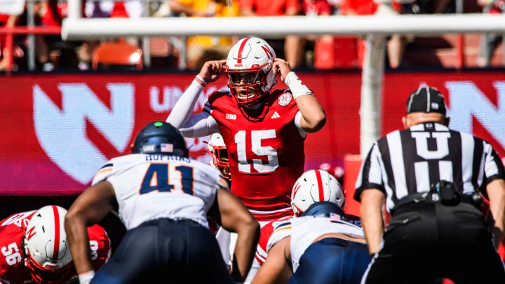 Dylan Raiola (15) calls a play before snapping the ball. 