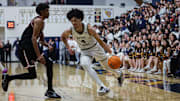 Notre Dame's Tyran Stokes (left) drives against Harvard-Westlake's Isaiah Carroll in Mission League showdown on Friday, Jan. 24, 2025.