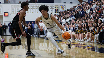 Notre Dame's Tyran Stokes (left) drives against Harvard-Westlake's Isaiah Carroll in Mission League showdown on Friday, Jan. 24, 2025.