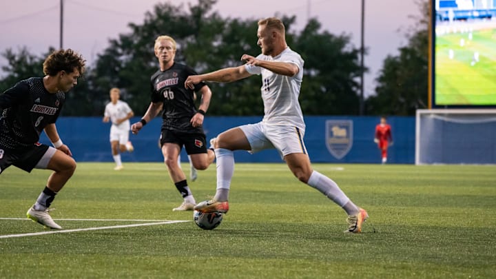 Pitt Men's Soccer forward Casper Grening dribbles in the 3-2 win vs. Louisville 