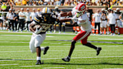 Sept. 13, 2025; Columbia, Missouri, USA; Missouri Tigers running back Ahmad Hardy pushes away from Louisiana Ragin' Cajuns' safety Jalen Clark on his way to the end zone.