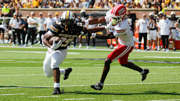 Sept. 13, 2025; Columbia, Missouri, USA; Missouri Tigers running back Ahmad Hardy pushes away from Louisiana Ragin' Cajuns' safety Jalen Clark on his way to the end zone.