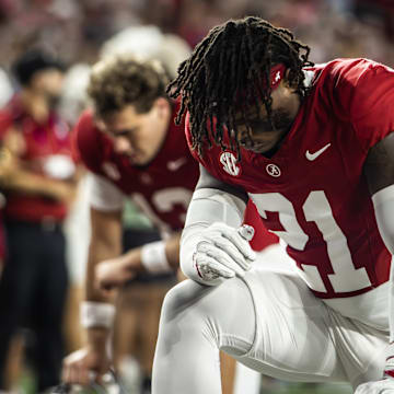 Alabama defensive back Dre Kirkpatrick Jr. takes a knee before the 2025 Third Saturday in October rivalry game. 