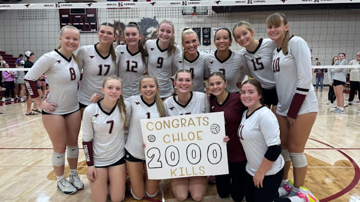 Mount Vernon's Chloe Meester celebrates with her teammates after recording her 2,000th career kill. Meester, a Louisville commit, is regarded as one of the top volleyball players in the state.