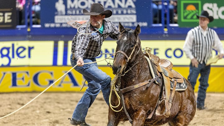 Caleb Smidt shown roping at the 2023 Wrangler National Finals Caleb Smidt shown roping at the 2023 Wrangler National Finals