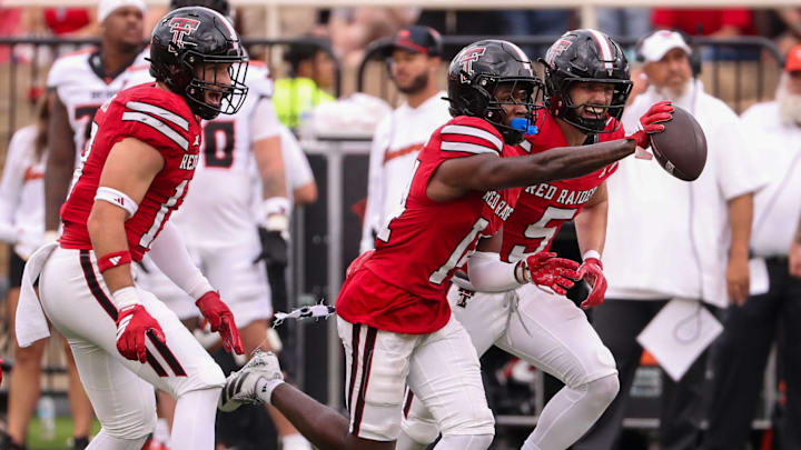 Texas Tech's Brice Pollock (center) celebrates his interception with Cole Wisniewski and Ben Roberts against Oregon State during a non-conference football game, Saturday, Sept. 13, 2025, at Jones AT&T Stadium.
