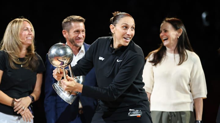 Phoenix Mercury guard Diana Taurasi (3) walks around with the WNBA Championship Trophy during the 2014 Phoenix Mercury championship team reunion on Friday, Sept. 13, 2024 at Footprint Center in Phoenix.