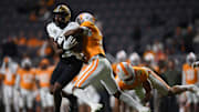 Vanderbilt TE Kamrean Johnson (48) is tackled by Tennessee defensive back Jaylen McCollough (2) during the game against Tennessee at Neyland Stadium in Knoxville, Saturday, Nov. 25, 2023.