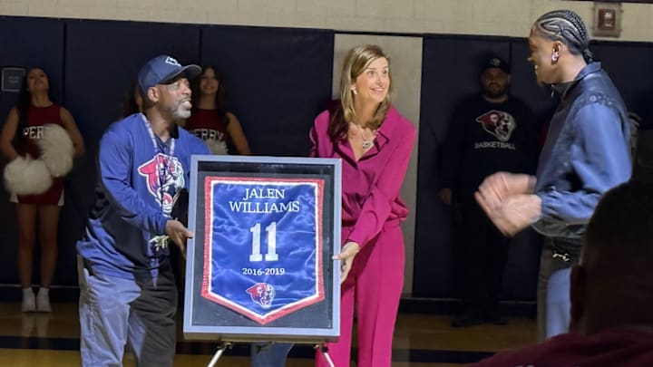 OKC Thunder star Jalen Williams witnesses as Perry High School staff members reveal his retired No. 11 jersey number on Tuesday.