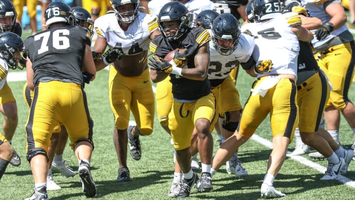 Iowa RB Jaziun Patterson carries the ball at practice on Aug. 10, 2024 in Iowa City. (Rob Howe/HN) 