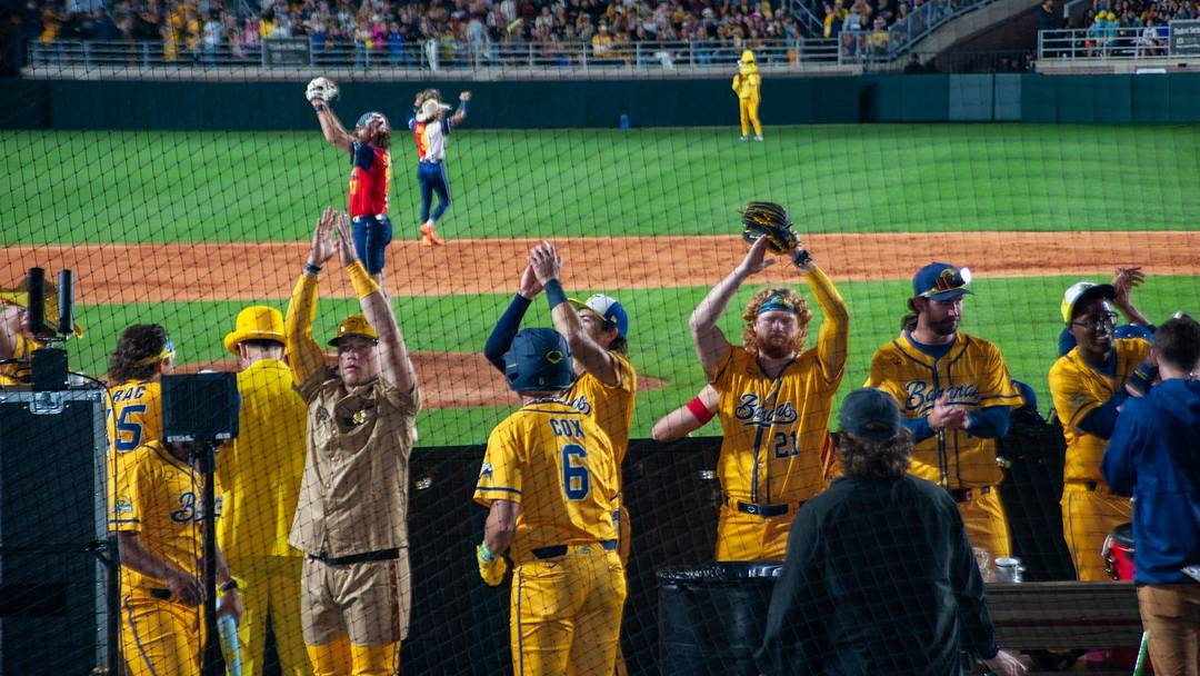 Bringing the spirit: Players from the Savannah Bananas celebrate a key play during their 5-3 victory in Tallahassee. The historic three-day opening weekend at Doak Campbell Stadium officially launched the team's nationwide 50-game regular season.